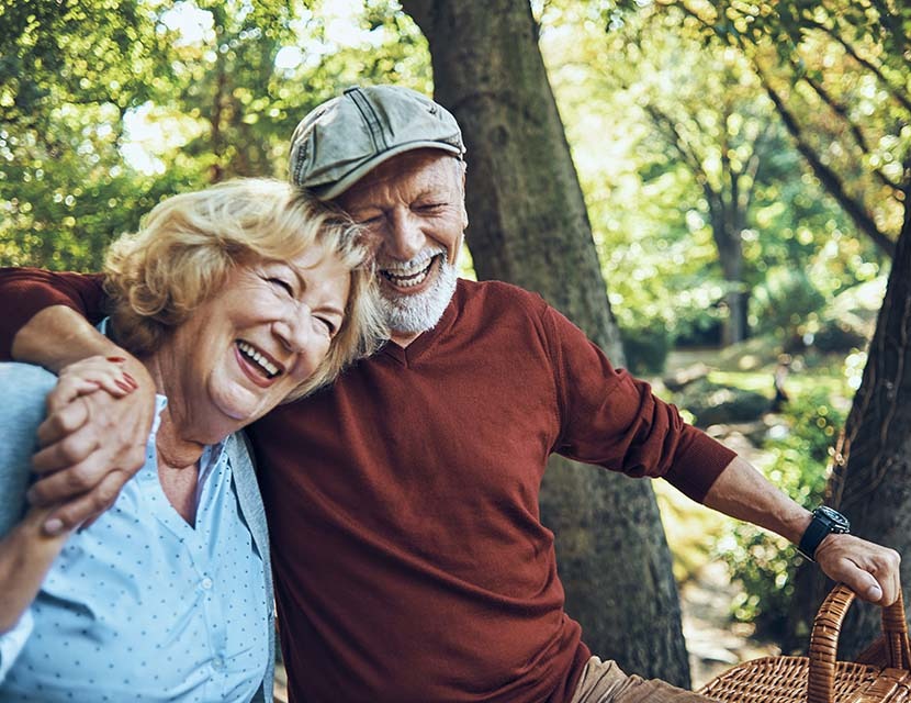 happy senior couple enjoying their day in nature