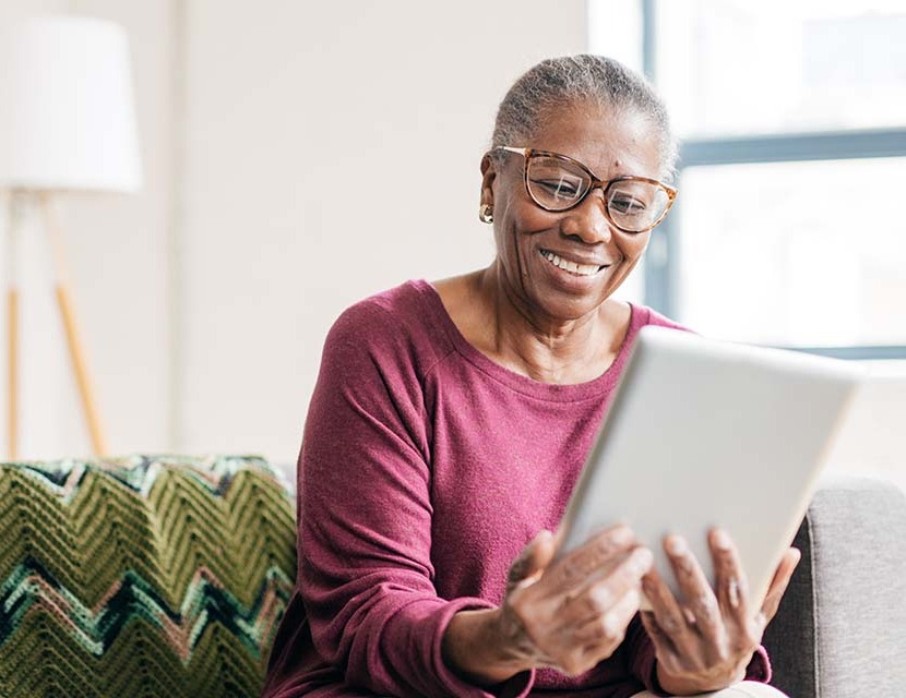 Senior women at home using tablet